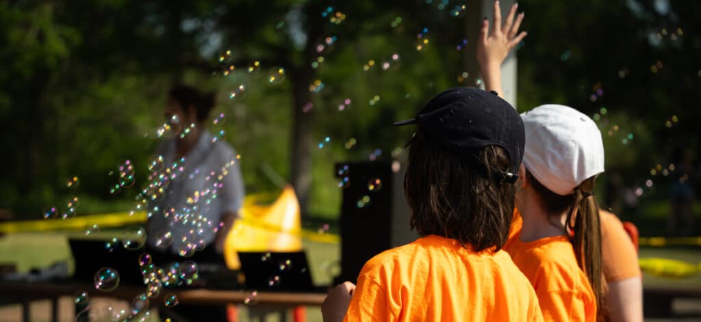 Patrollers enjoy a moment of calm while checking out the bubble magic activity station.