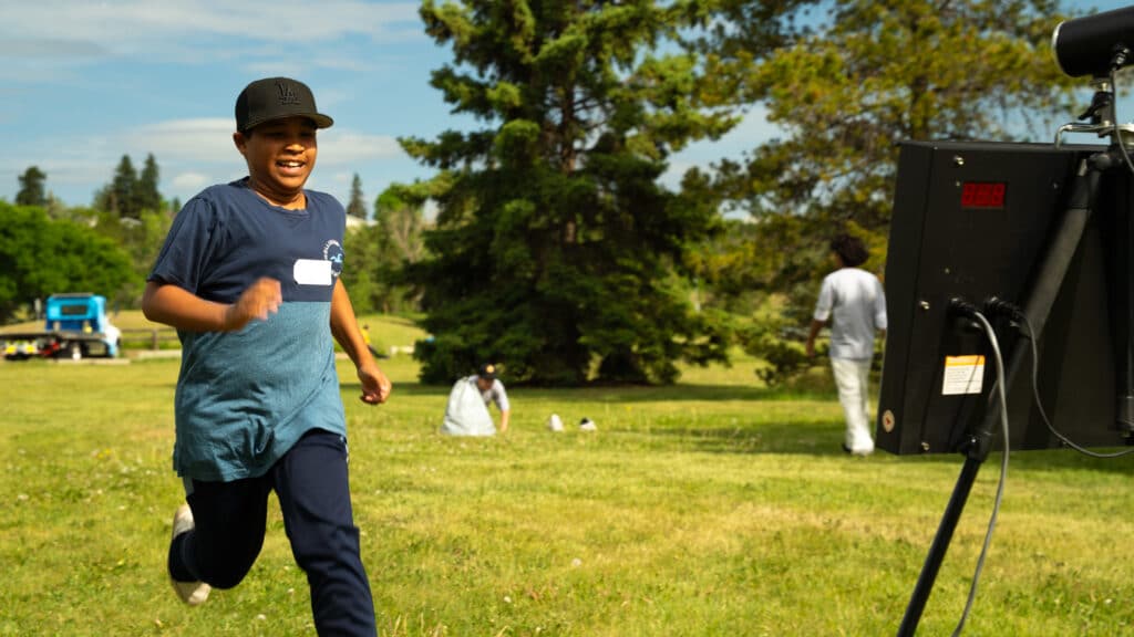 A young patroller dashes by a speed trap to see how fast he can run.