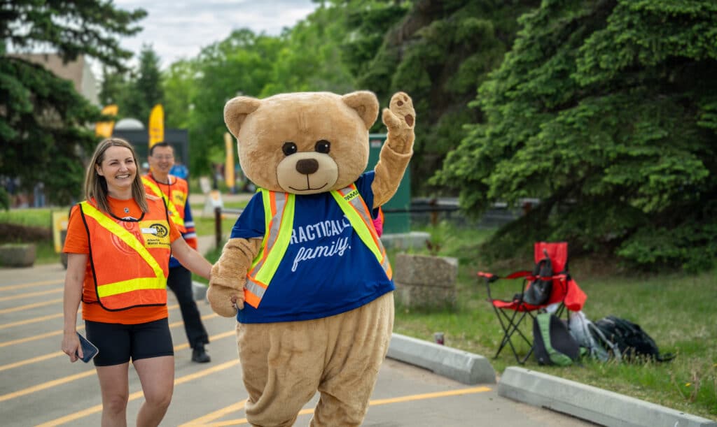 Teddy welcomes patrollers to the Edmonton year end party.