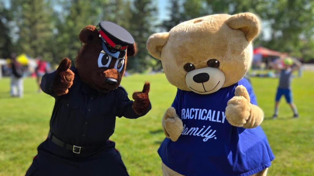 Teddy and Simon the Safety Bear (Calgary Police Service) give a big thumbs up to this year's AMA School Safety Patrollers.