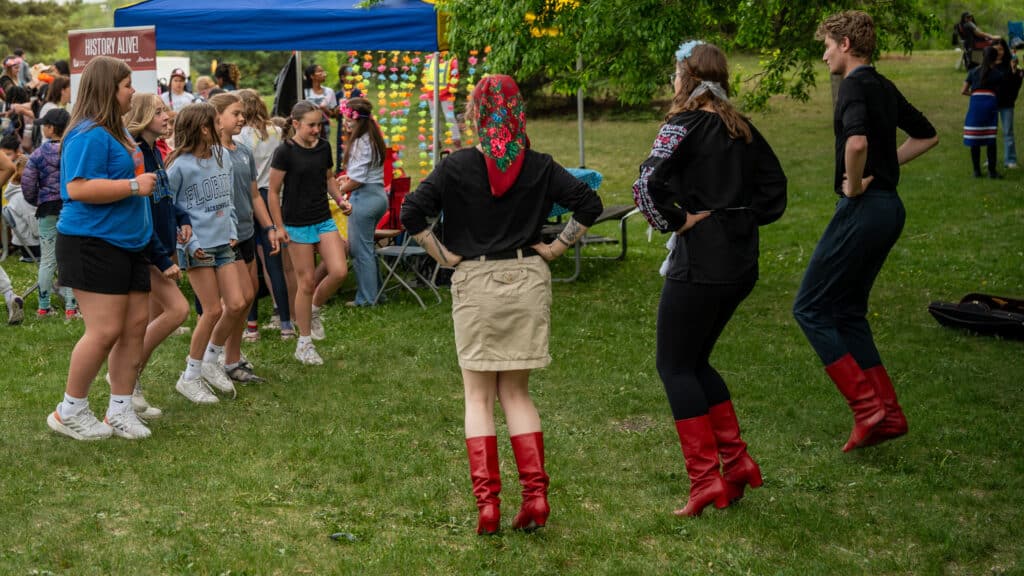 Dancers from the Ukrainian Cultural Heritage Village teach a group of patrollers a few traditional dance moves.